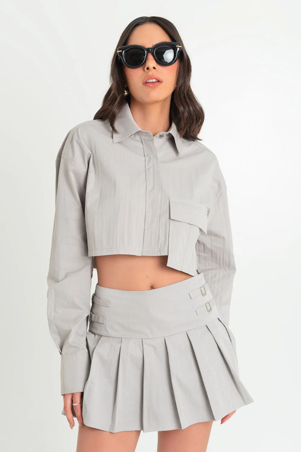 Camisa cropped de manga larga bolsillo